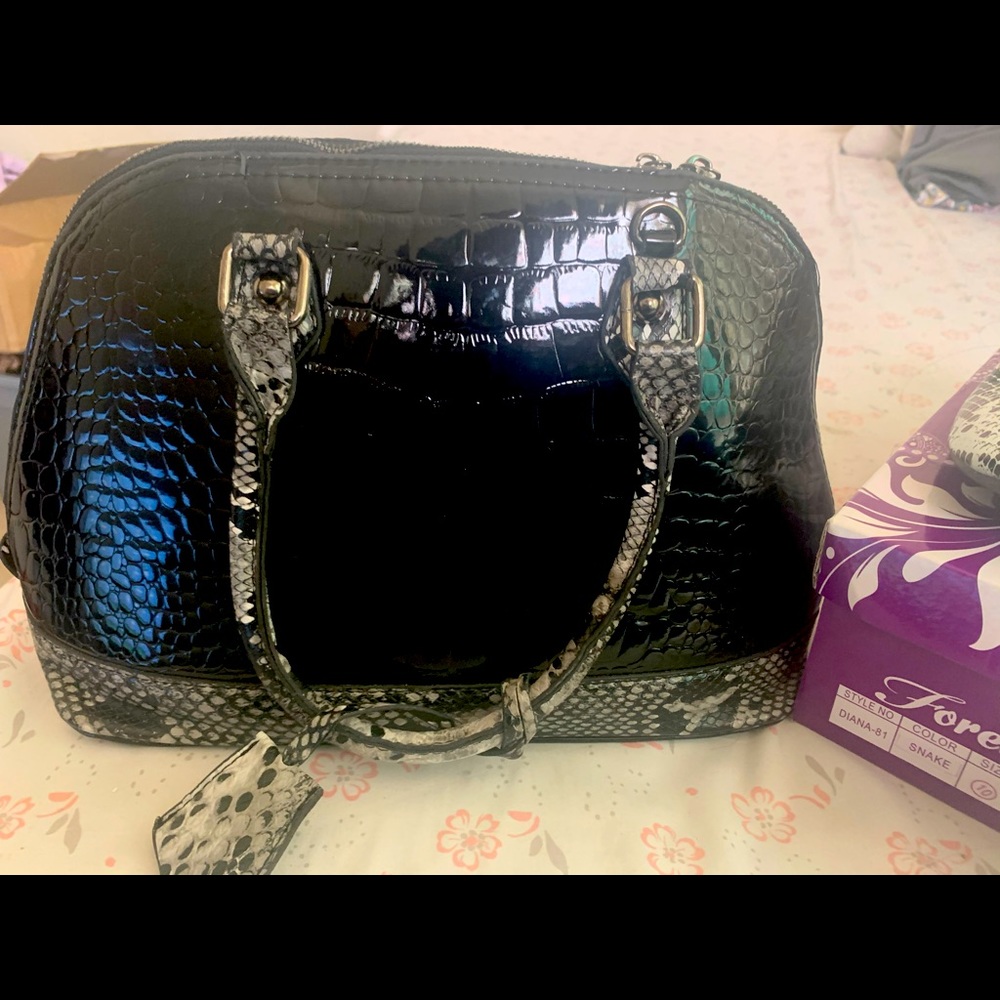 Black snake purse in shoes